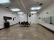 Spacious room with tables, a seating area, and access to restrooms, perfect for events at 7860 E Camelback Rd # 309, Scottsdale, AZ 85251