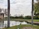Picturesque pond framed by palm trees, lush greenery, and local wildlife at 7860 E Camelback Rd # 309, Scottsdale, AZ 85251
