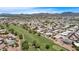 A sprawling golf course community with well-maintained greens and stunning mountain views in the distance at 805 S 82Nd Pl, Mesa, AZ 85208