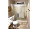 This bathroom features a glass-enclosed shower, toilet, and storage shelves at 805 S 82Nd Pl, Mesa, AZ 85208