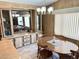 Cozy dining area with a classic wooden table, stylish furnishings, and a decorative wall unit at 805 S 82Nd Pl, Mesa, AZ 85208