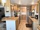 Open kitchen with wood cabinets, stainless steel appliances, and an island with breakfast bar at 805 S 82Nd Pl, Mesa, AZ 85208