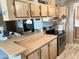 Well-equipped kitchen boasting wood cabinets, an island with breakfast bar, and modern appliances at 805 S 82Nd Pl, Mesa, AZ 85208