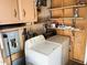 Functional laundry area with washer, dryer, and ample shelving for storage convenience at 805 S 82Nd Pl, Mesa, AZ 85208