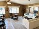 Spacious carpeted living room with a ceiling fan, large windows and lots of natural light at 805 S 82Nd Pl, Mesa, AZ 85208