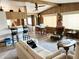 Inviting living room with wood accents, comfortable seating, and an open layout to the kitchen and dining area at 805 S 82Nd Pl, Mesa, AZ 85208