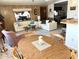 Inviting living space featuring plush sofas, warm lighting, and a dining area at 805 S 82Nd Pl, Mesa, AZ 85208