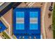 Top-down view of pristine blue pickleball courts in a well-maintained recreational area at 805 S 82Nd Pl, Mesa, AZ 85208