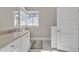 Bright bathroom featuring a modern vanity with stone countertop and natural light at 841 N 2Nd Ave # 104, Phoenix, AZ 85003