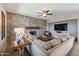 Inviting living room featuring a stone fireplace and comfortable seating at 9096 E Mountain Spring Rd, Scottsdale, AZ 85255