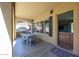 Exterior patio featuring a dining table, and a view to the backyard at 9096 E Mountain Spring Rd, Scottsdale, AZ 85255