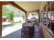 Covered patio with an outdoor dining area, grill, and views of the private backyard at 9096 E Mountain Spring Rd, Scottsdale, AZ 85255