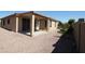 Cozy backyard with a covered patio and gravel landscaping at 9763 W Butler Dr, Peoria, AZ 85345