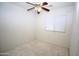 Bedroom with neutral walls, plush carpet, a ceiling fan, and window at 9763 W Butler Dr, Peoria, AZ 85345