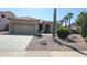 Charming single-story home featuring desert landscaping, gravel, and a two car garage at 9763 W Butler Dr, Peoria, AZ 85345
