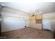 Spacious two-car garage with ample storage, tool rack and epoxy floor at 9763 W Butler Dr, Peoria, AZ 85345
