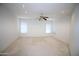 Bright and spacious living room featuring neutral walls, recessed lights, and large windows at 9763 W Butler Dr, Peoria, AZ 85345
