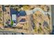 Overhead view of a home with a patio, yard, and winding driveway at 9780 E Baseline Ave, Gold Canyon, AZ 85118