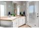 Well-lit bathroom with stone countertops, double vanity, and modern fixtures at 9780 E Baseline Ave, Gold Canyon, AZ 85118