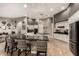 Open kitchen with granite countertops, pendant lighting, and seating area for casual dining at 9780 E Baseline Ave, Gold Canyon, AZ 85118