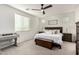 Comfortable bedroom featuring a bed, ceiling fan, and ample natural light at 10657 E Texas Ave, Mesa, AZ 85212