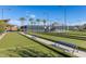 Scenic bocce ball court with seating and shade, perfect for outdoor recreation and community gatherings at 10657 E Texas Ave, Mesa, AZ 85212