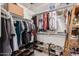 Walk-in closet features clothing racks, shelving, and storage for ample wardrobe organization at 10657 E Texas Ave, Mesa, AZ 85212