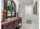 Stylish entryway featuring a decorative mirror, modern accents, and easy access to other rooms at 10657 E Texas Ave, Mesa, AZ 85212
