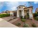 Charming single-story home with a tile roof, brick walkway, and lovely landscaping at 10657 E Texas Ave, Mesa, AZ 85212