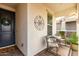 Inviting front porch with a cozy seating area perfect for enjoying the outdoors at 10657 E Texas Ave, Mesa, AZ 85212