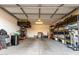 Spacious garage with ample storage, including shelves and overhead racks, for organization and convenience at 10657 E Texas Ave, Mesa, AZ 85212