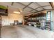 Spacious garage with ample storage solutions, including shelving units, storage bins and tool organizers at 10657 E Texas Ave, Mesa, AZ 85212