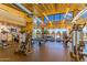 Community gym with updated equipment, floor to ceiling windows, and views of the pool at 10657 E Texas Ave, Mesa, AZ 85212