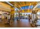 Community gym with updated equipment, floor to ceiling windows, and views of the pool at 10657 E Texas Ave, Mesa, AZ 85212