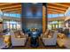 Cozy lobby with a grand fireplace, comfortable seating, and stylish decor for relaxation and gathering at 10657 E Texas Ave, Mesa, AZ 85212