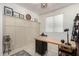 Bright home office with white walls and stylish wainscoting, perfect for remote work or creative endeavors at 10657 E Texas Ave, Mesa, AZ 85212