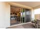 Covered patio offering an outside view of the gourmet kitchen with its dine-in kitchen island at 10657 E Texas Ave, Mesa, AZ 85212