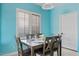 Charming dining area with a wood table, seating for six, and light blue walls at 10718 E Secret Canyon Rd, Gold Canyon, AZ 85118