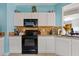 Kitchen featuring granite countertops, white cabinets, and stainless steel appliances at 10718 E Secret Canyon Rd, Gold Canyon, AZ 85118