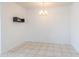 The dining room features tile floors, a modern chandelier, a hanging shelf, and bright white walls at 11310 E Wallflower Ln, Florence, AZ 85132