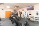 Well-equipped gym featuring cardio machines and weights for a convenient workout experience at 12212 N Paradise Village S Pkwy # 129, Phoenix, AZ 85032