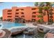 Stunning pool area with waterfall feature and lush landscaping, creating a resort-like atmosphere at 12212 N Paradise Village S Pkwy # 129, Phoenix, AZ 85032