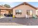 Spacious backyard with gravel landscaping, a covered patio, outdoor seating, and a BBQ area at 1344 W Seascape Dr, Gilbert, AZ 85233