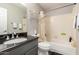 Bathroom features a granite-topped vanity, a toilet, and a tub/shower combo with grey walls at 1344 W Seascape Dr, Gilbert, AZ 85233