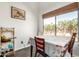 Quaint dining area featuring seating for four with outdoor view from the window and tiled flooring at 1344 W Seascape Dr, Gilbert, AZ 85233