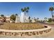 Attractive community fountain with a decorative base and lush desert landscaping at 1344 W Seascape Dr, Gilbert, AZ 85233