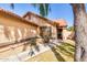 Inviting front entrance with a covered porch, manicured lawn, and shade tree at 1344 W Seascape Dr, Gilbert, AZ 85233