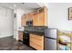 Efficient kitchen with stainless steel appliances, tile backsplash, maple cabinets, and ample countertop space at 1344 W Seascape Dr, Gilbert, AZ 85233