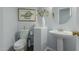 Cozy powder room with a pedestal sink, toilet, decorative vase, and framed picture at 14741 E Mountain Majesty --, Fountain Hills, AZ 85268