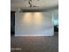 A clean, empty room provides versatile space, highlighted by recessed lighting and neutral wall color at 14741 E Mountain Majesty --, Fountain Hills, AZ 85268